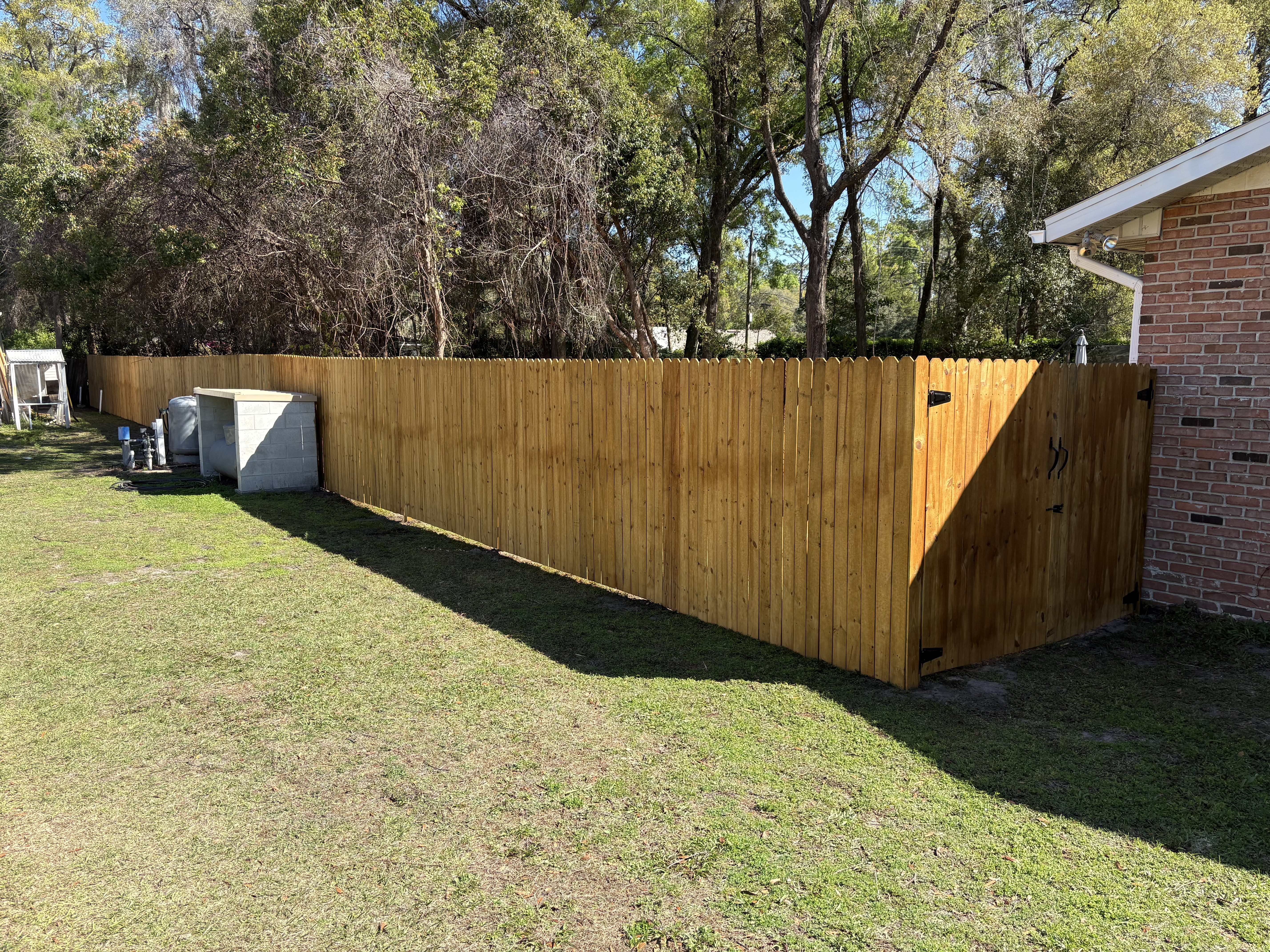 New fence along a pasture and driveway.